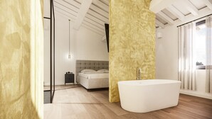 A modern bathroom with a freestanding bathtub, a large mirror, and a window with curtains. - Best Of Tuscany between Chianti, Pisa, Florence 7 (San Miniato Basso)
