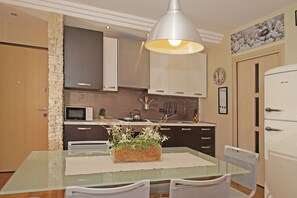 Apartment, Lake View | Dining room - Le Terrazze PT 31 by Wonderful Italy (Toscolano Maderno)