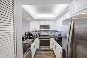 Coffee/tea maker, toaster, dining tables