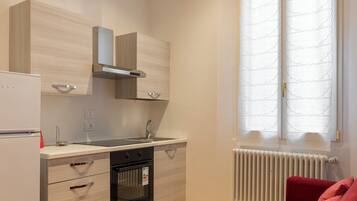 Apartment | Private kitchen | Cookware/dishes/utensils, freezer, dining tables
