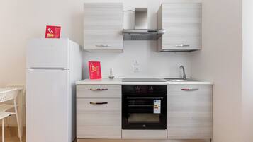 Apartment | Private kitchen | Cookware/dishes/utensils, freezer, dining tables