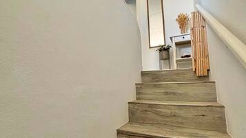 A staircase with wooden steps leading to a landing.