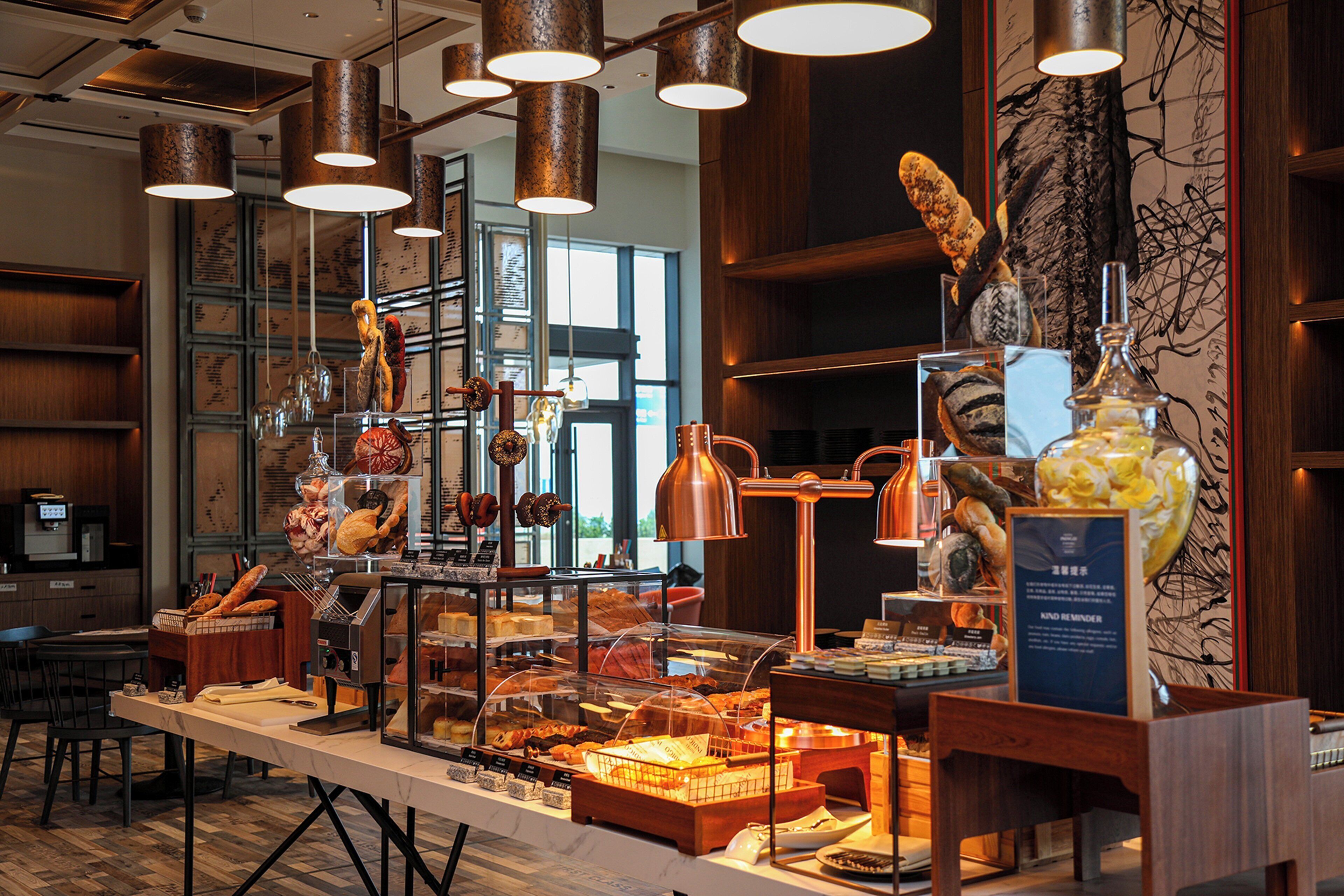 A breakfast buffet with various food items and a coffee station.