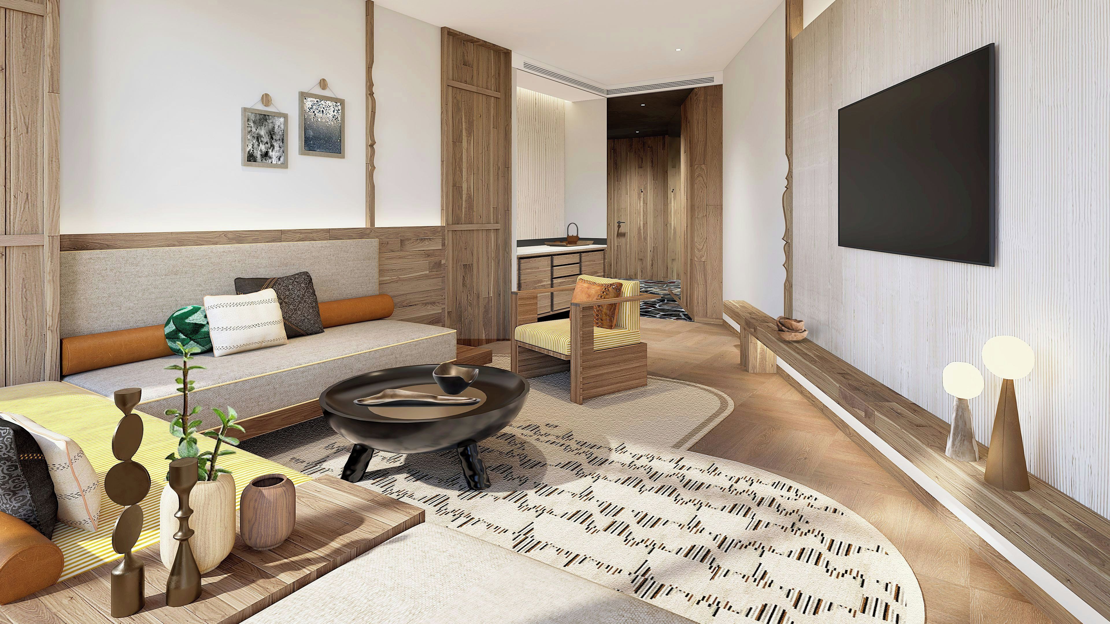 A modern living room with a sofa, a coffee table, a TV, and a patterned rug.