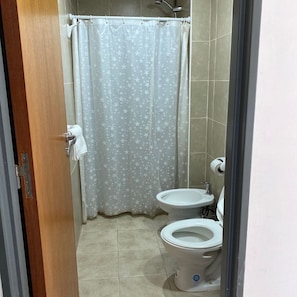 Bidet, towels, soap, toilet paper