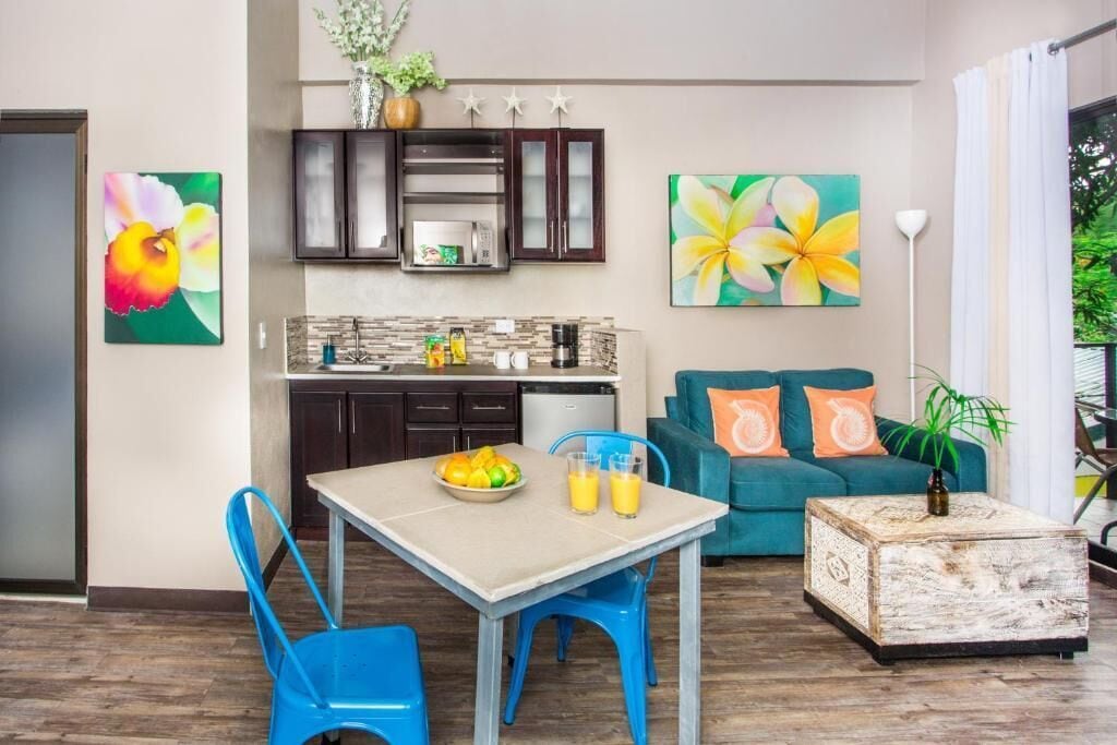 A compact living space with a kitchen, dining area, and seating area.