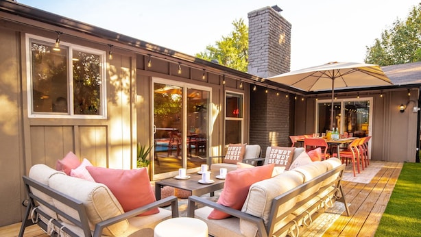 An outdoor patio with a sofa, chairs, and a dining table. - Pool, Pickleball, Resort Backyard, 16min to Downtown - Modern Cowgirl (Austin)