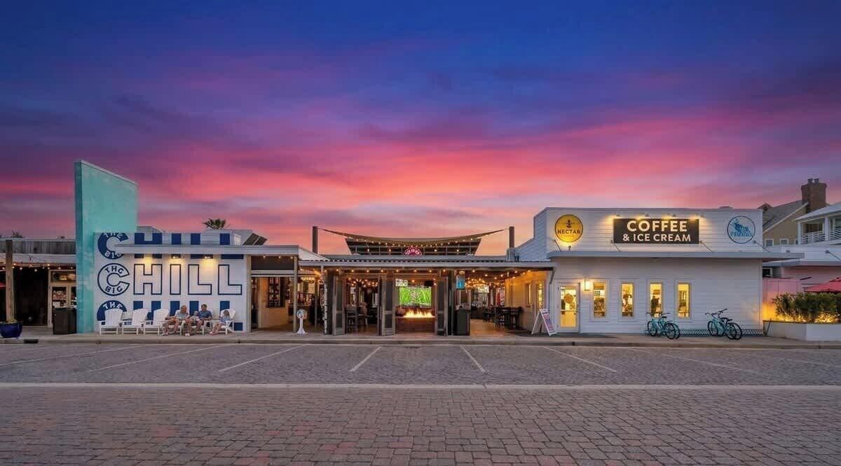 A building with a sign for 'Coffee & Ice Cream' and a mural with the word 'CHILL'.
