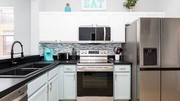 Townhome, Multiple Beds, Pool Access, Garden View (Just Beachy at Regal Palms) | Private kitchen | Coffee/tea maker