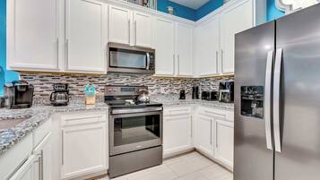 Condo, Multiple Beds, Balcony, Garden View (Oasis Hideaway at Bahama Bay) | Private kitchen | Coffee/tea maker