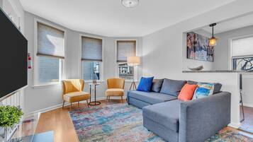 Apartment, Multiple Beds, Balcony, Garden View | Living area