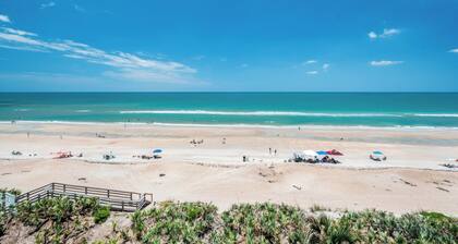 Updated direct oceanfront condo with a private balcony, heated pool, and beach access