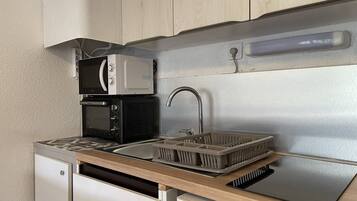 Fridge, microwave, toaster, cookware/dishes/utensils