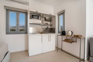 Fridge, microwave, stovetop, coffee/tea maker