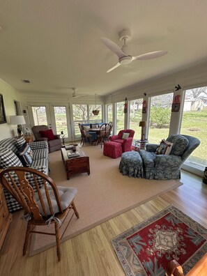 Smart TV, fireplace, books, printers