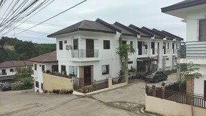 A residential building with multiple floors, balconies, and a gated entrance. - Antonioville Subdivision (Mandaue)