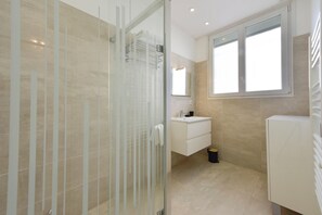 Shower, hair dryer, towels, soap