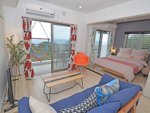Two-Bedroom Apartment, 2nd - 4th Floor, Non Smoking | Living area - churaumi terrace (Motobu)