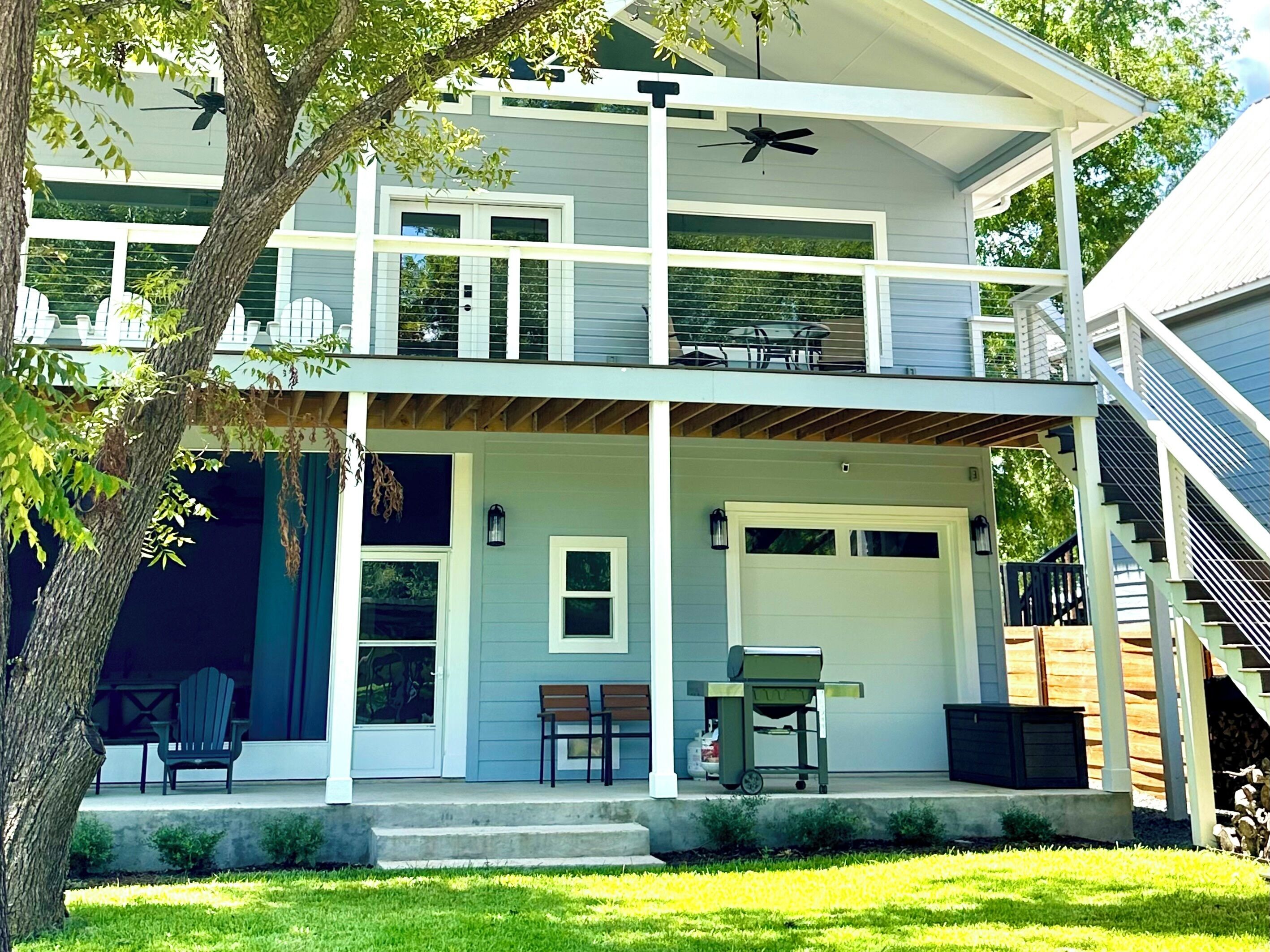 Two levels of covered decks, screened patio, and grill just steps from the dock
