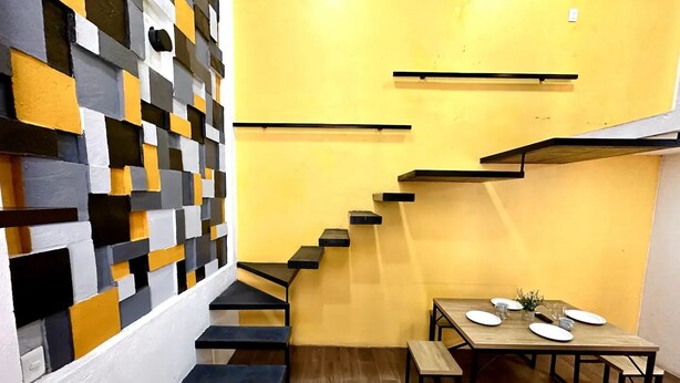 A modern interior with a staircase leading to a dining area. - VIP 2 Bedrooms Apt at Historic Center TV Roof (Oaxaca de Juárez)