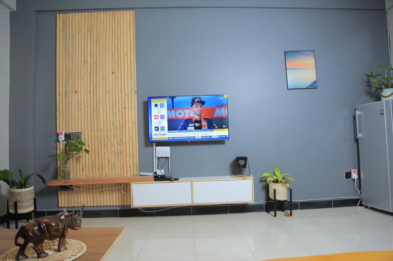 Deluxe Apartment, Non Smoking, Hill View | Living area | Flat-screen TV