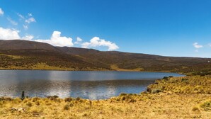 A lake surrounded by hills. - Anabas Mount Kenya Lodge (Igoji)