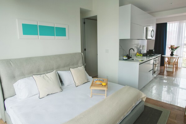 Fer et planche à repasser, lit parapluie, Wi-Fi gratuit, draps fournis