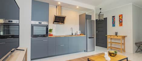 Apartamento luxo | Cozinha privada | Geladeira grande, fogão, cooktop, lava-louças