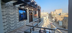A modern building with a brick facade and large windows. - Mirpur 3-bed House Sleeps 6 (Mirpur)
