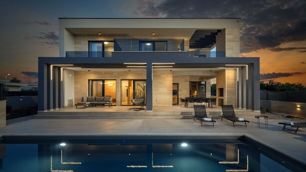 A modern two-story house with a swimming pool, outdoor seating, and a staircase leading to the upper floor. - Villa Roko Nin ZadarVillas (Nin)