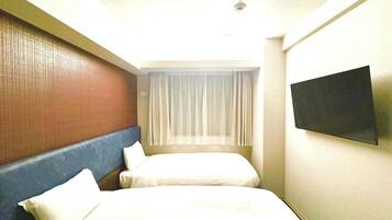 Basic Twin Room, City View | Down comforters, desk, laptop workspace, blackout drapes