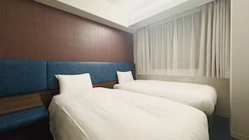 Basic Twin Room, City View | Down comforters, desk, laptop workspace, blackout drapes