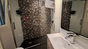 Shower, hair dryer, towels, soap