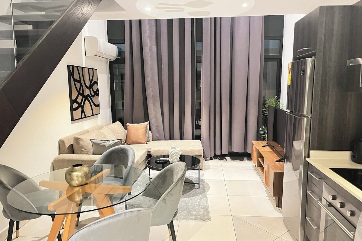 Luxury Duplex, 1 Bedroom | Living area | 55-inch Smart TV with satellite channels, Netflix, streaming services