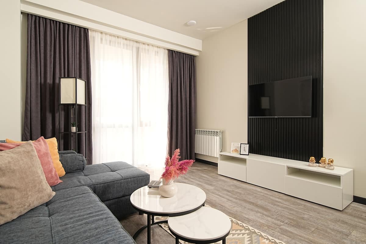 Superior Apartment, 1 Bedroom, Non Smoking, Balcony | Living area | 50-inch Smart TV with cable channels, pay films