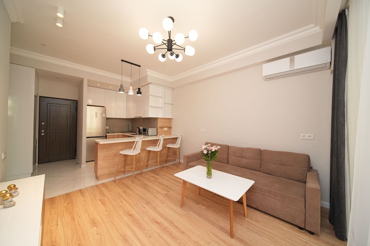Superior Apartment, 1 Bedroom, Non Smoking, Balcony | Living area | 50-inch Smart TV with cable channels, pay films