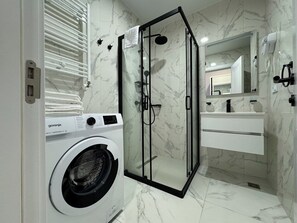 Hair dryer, towels, soap, shampoo