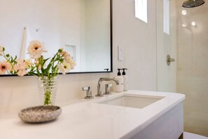 Shower, eco-friendly toiletries, hair dryer, towels