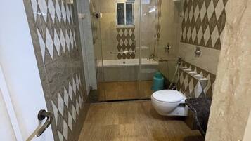 Shower, rainfall showerhead, towels, soap