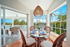 Outdoor dining - Island time..walk to beach, heated pool, wide water views. Pet friendly! (Sanibel)