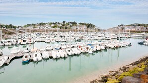 A marina with numerous boats docked, a pier, and buildings in the background. - House for 6 with a view of the port of Dahouët (Pléneuf-Val-André)