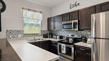 Townhome, Multiple Beds, Patio, Garden View (Mickey’s Oasis At Regal Palms) | Private kitchen | Coffee/tea maker