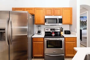 House, Multiple Beds, Pool Access, Pool View (Emerald Island Happy Place) | Private kitchen | Fridge, microwave, oven, stovetop