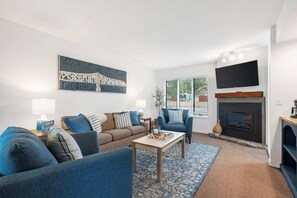 Condo, Multiple Beds, Balcony (Lakefront Oasis) | Living area | 42-inch flat-screen TV with digital channels, fireplace