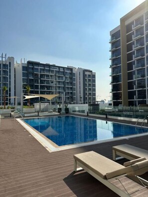 Pool - Charming 1BR Apartment in Azizi Gardens Nad Al Sheba by Deluxe Holiday Homes (Dubai)