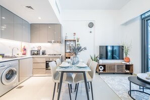 Fridge, microwave, oven, stovetop - Charming 1BR Apartment in Azizi Gardens Nad Al Sheba by Deluxe Holiday Homes (Dubai)