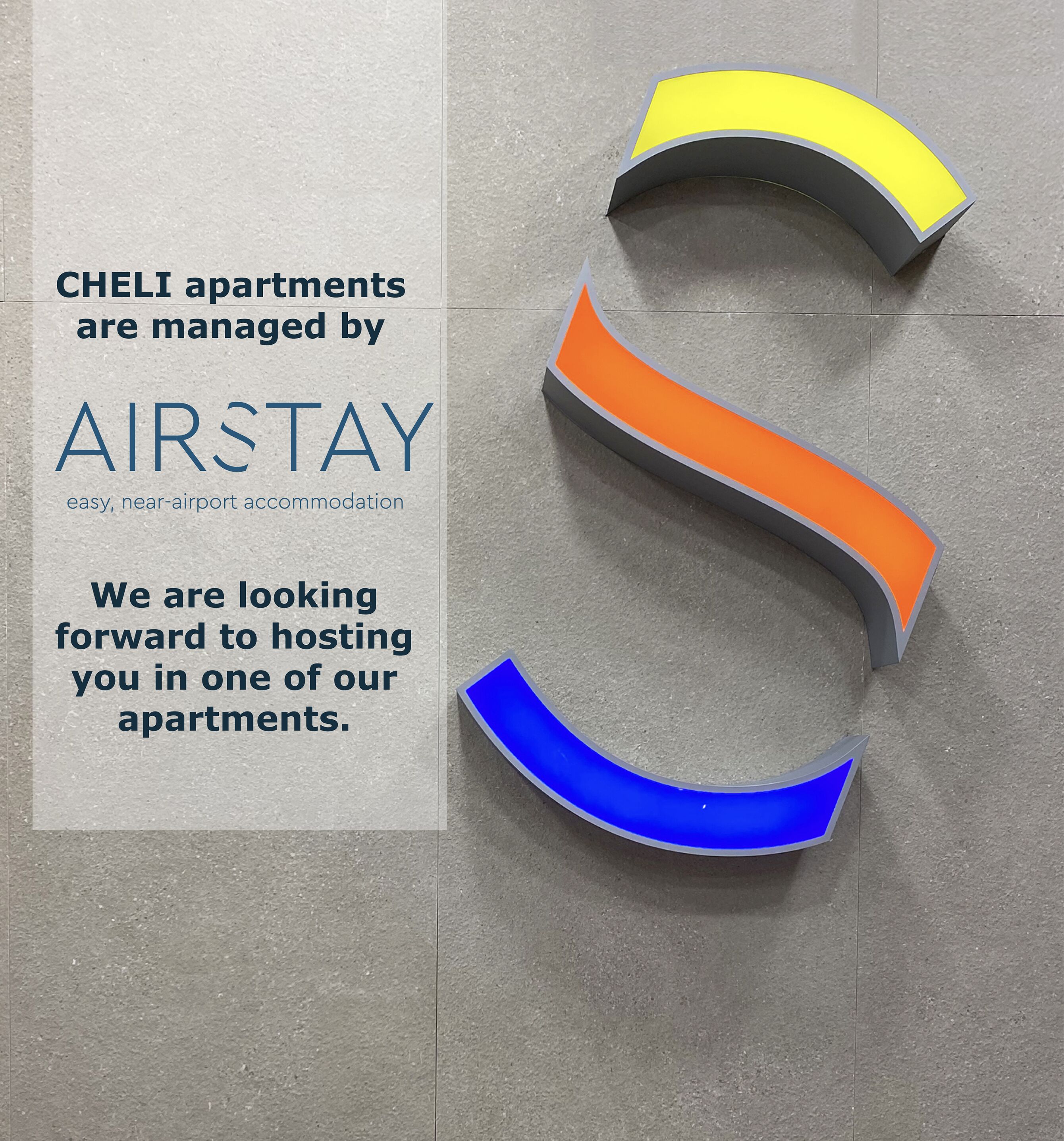 A sign for CHEL apartments managed by AIRSTAY, mentioning easy, near-airport accommodation and a look forward to hosting guests.