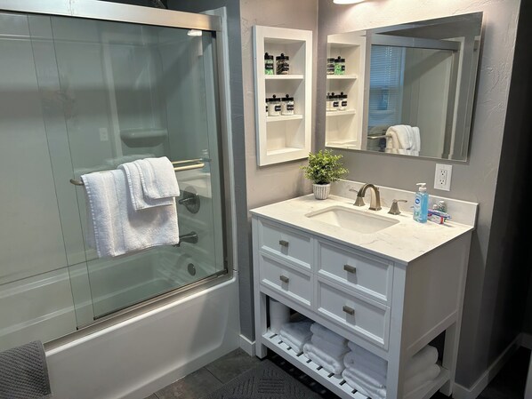 Shower, hair dryer, towels, soap
