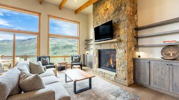 Smart TV, fireplace, books, stereo