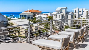A rooftop terrace with lounge chairs and a view of the ocean. - Expansive Designer Home with Gulf Views, One Min to Beach, Private Pool, LSV (Santa Rosa Beach)
